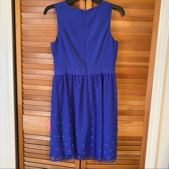 Blue dressy sleeveless dress with polka dot overlay and inner lining on bottom. - Picture 2 of 3